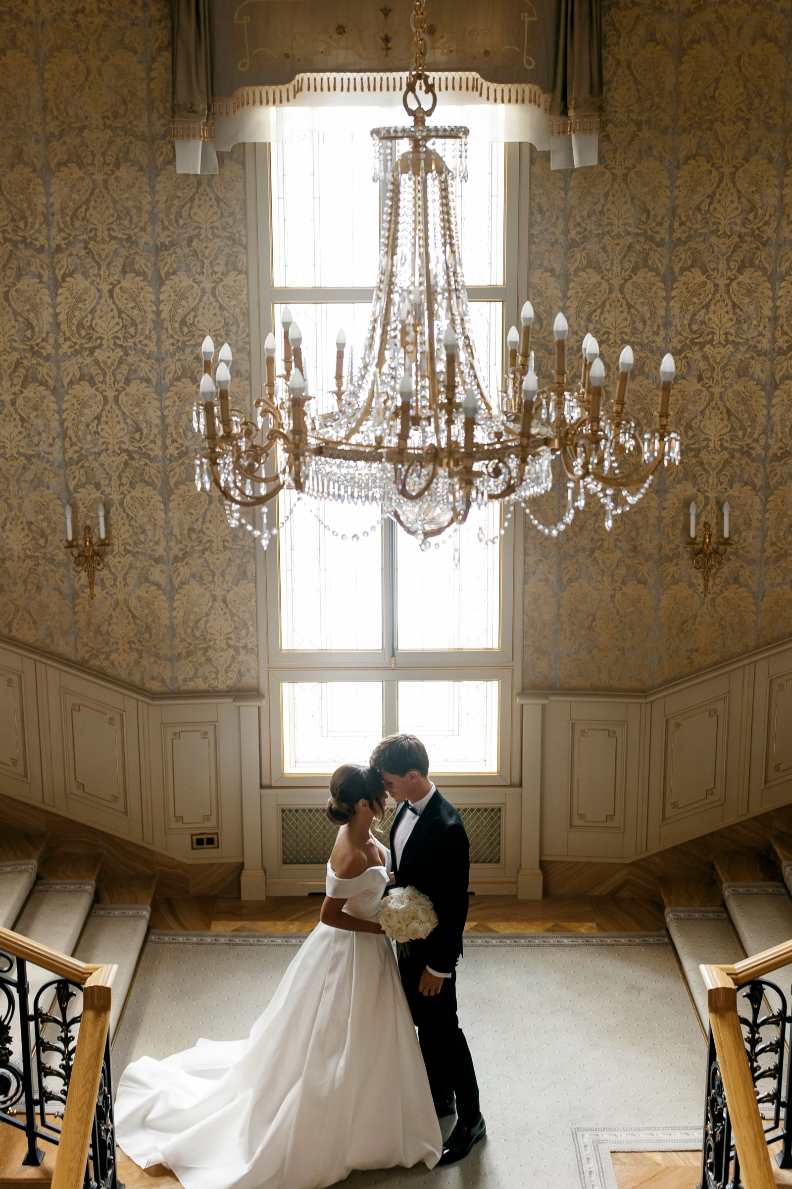 Bride groom luxury room crystal chandelier damask wallpaper