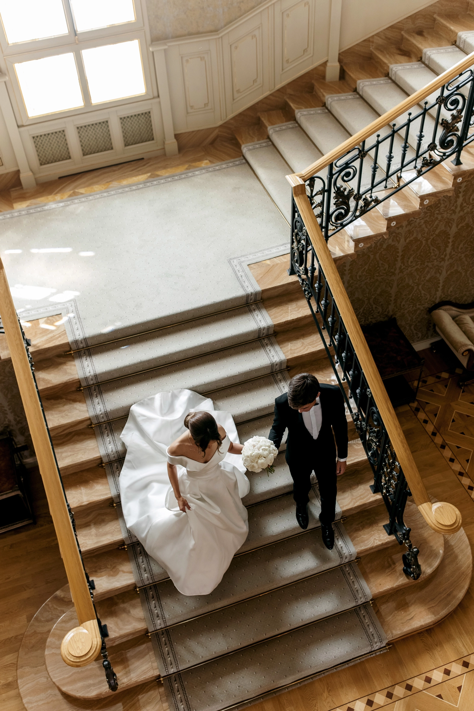 Bride groom grand staircase white columns classical interior