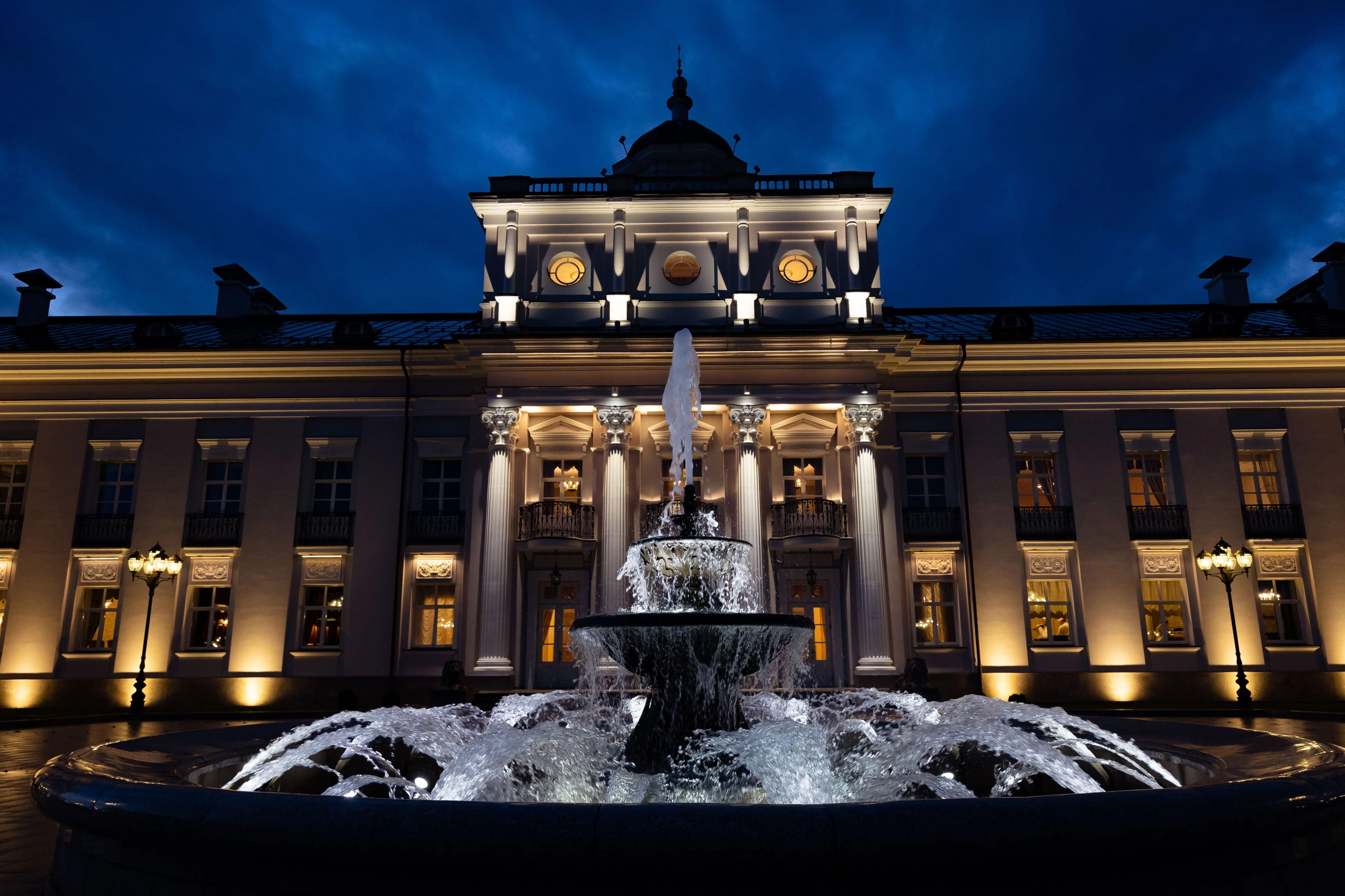 Palazzo fountain blue dusk architectural golden light evening