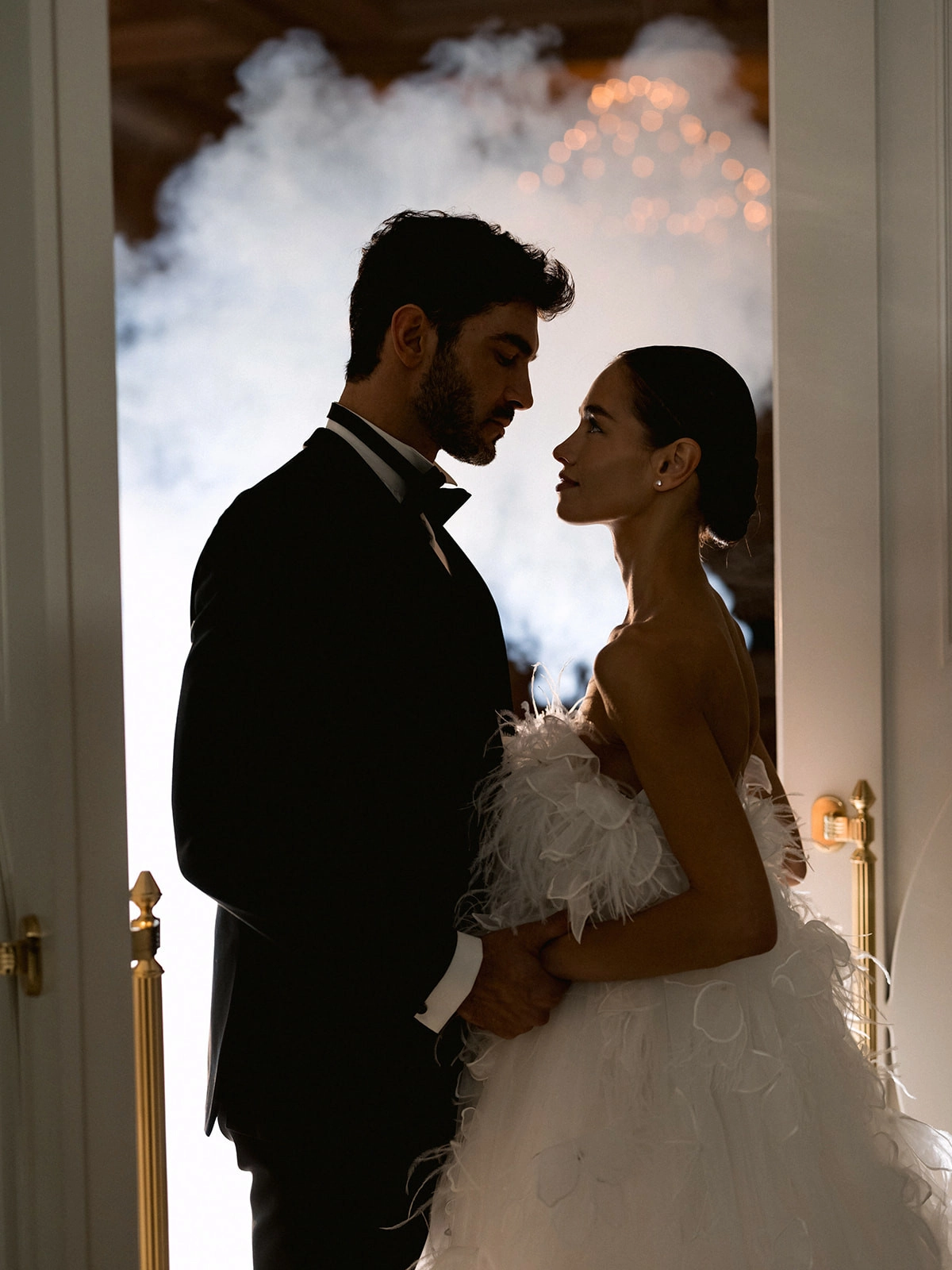Couple silhouette bride feathered dress groom tuxedo venue