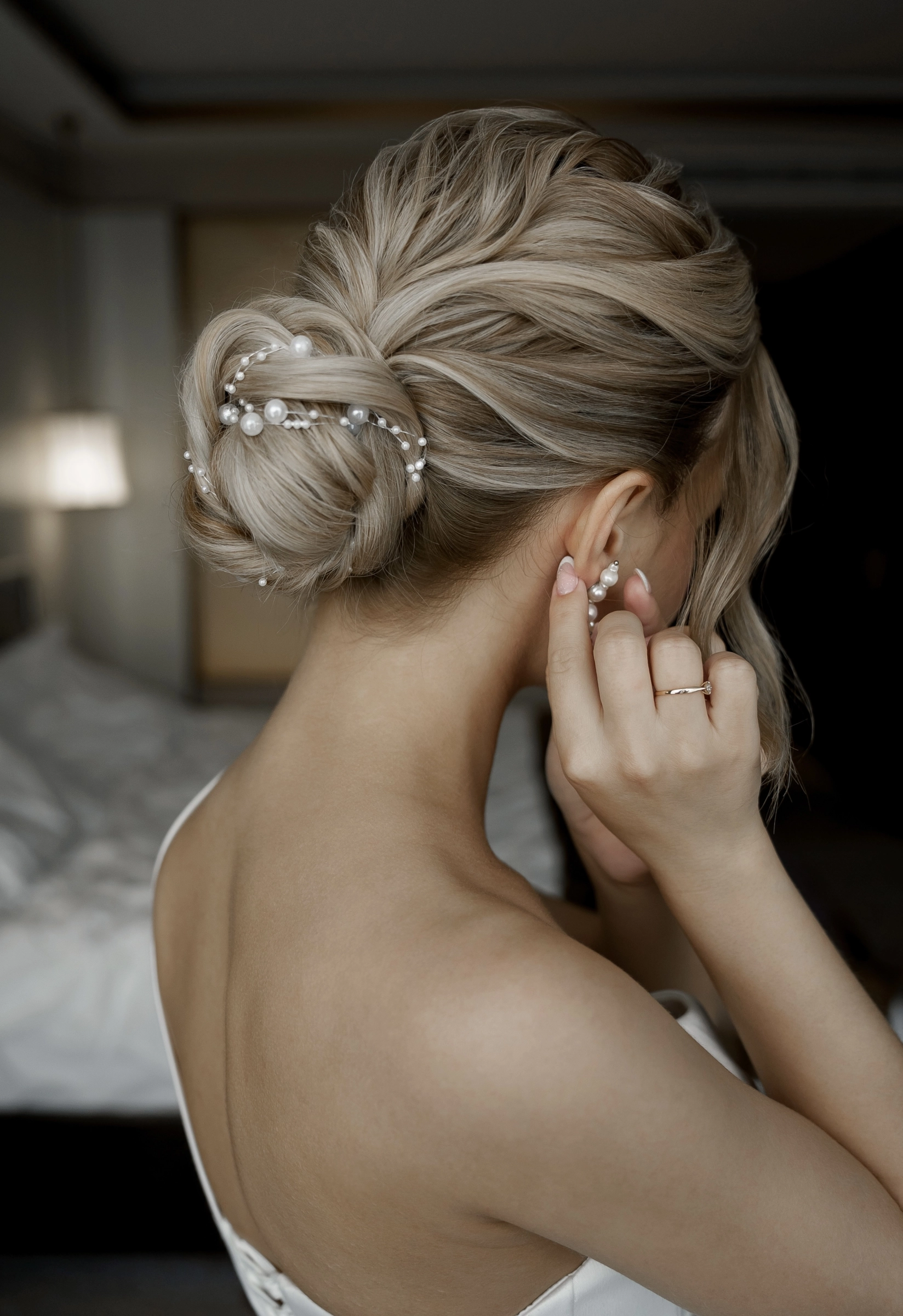 Twisted updo pearl hair pins bridal hairstyle detail