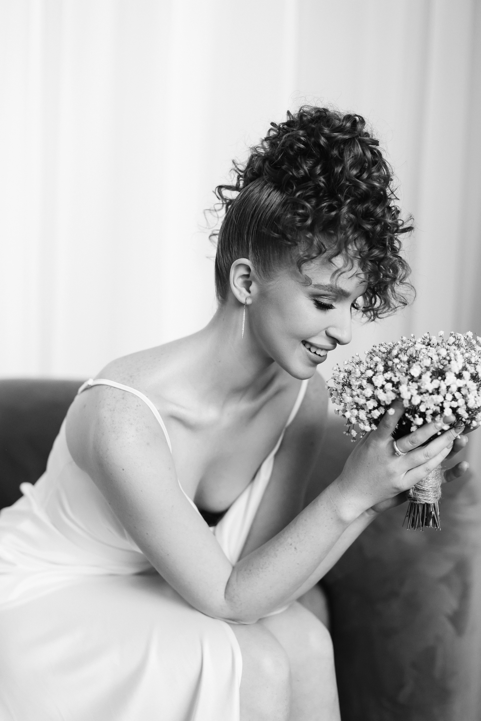 Upswept curly updo baby's breath bouquet bridal